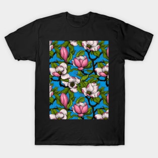 Blooming magnolia on blue T-Shirt